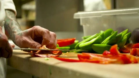 Chef cutting vegetables, green and red peppers 4K Stock-Footage 158036329
