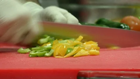 Chef cutting up the vegetables with a knife. Close up Stock Footage 75334377