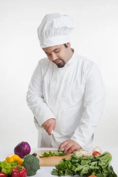 Chef cutting vegetables Stock Photos