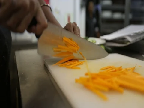 Chef cutting vegetables in slow motion Stock-Footage 77579218