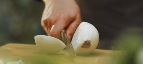 Chef cutting white onions with knife Stock Footage 311834917