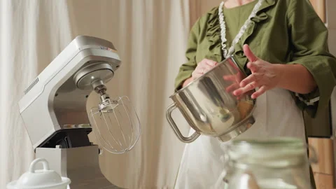 Chef Dancing in Kitchen While Tapping Reflective Stainless Steel Mixing Bowl Stock Footage 307124597