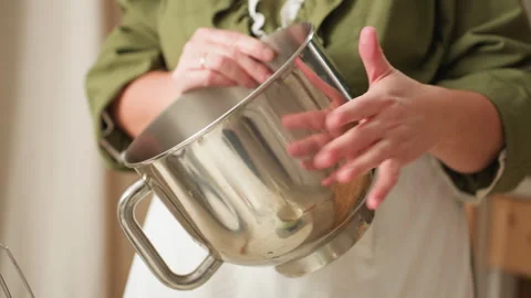 Chef Dancing While Tapping Reflective Stainless Steel Mixing Bowl Stock Footage 307124584