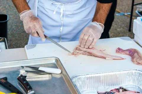 Chef deboning monkfish Stock Photos