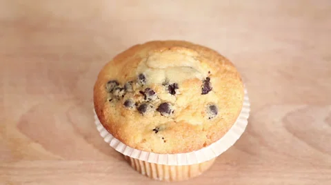 Chef decorates cupcake with cream, sprinkles and raspberry Stock Footage 34776903