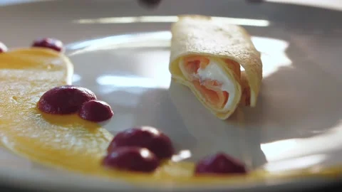 The chef decorates the dish with food, breakfast, stuffed pancakes Stock Footage 149407712