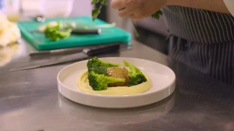 The chef decorates the dish with herbs. Stock Footage 277132062