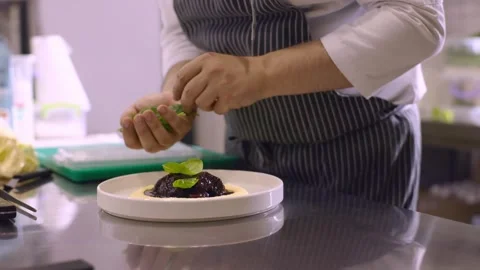 The chef decorates the dish with herbs. Video stock 277132481