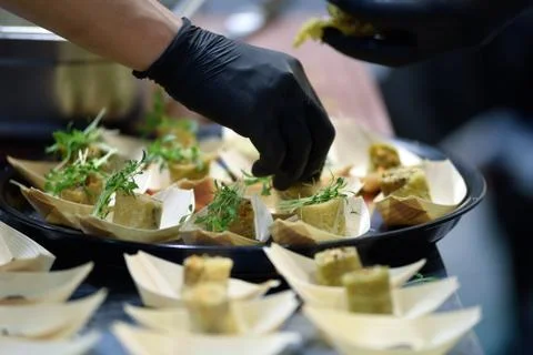 Chef decorates the dish Stock Photos