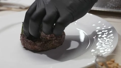 Chef decorates meat on a plate Stock Footage 170395931