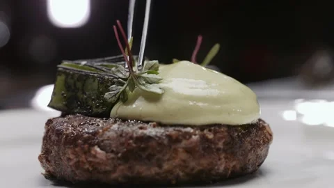 Chef decorates meat on a plate Stock Footage 170395956