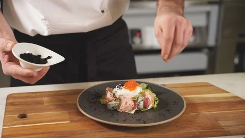 The chef decorates the original salad for serving. Light vegetable salad with Stock Footage 150195831