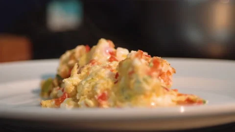 The chef decorates the scramble with greens Stock Footage 158021762