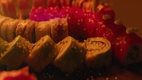 Chef decorates sushi rolls close up Stock Footage 141152414