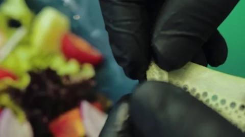 Chef decorates vegetable salad, close-up, health food Stock Footage 113153028