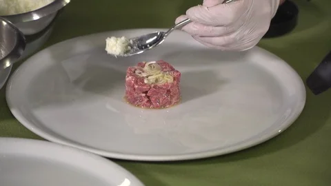 Chef decorating beef tartar dish  Stock Footage 101634914