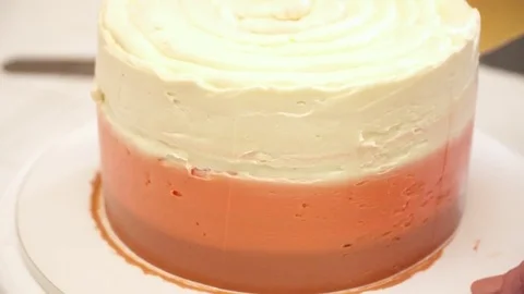 Chef decorating cake with a different cream Stock Footage 74587763