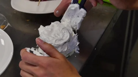 Chef decorating a delicious cake with cream. Cooking a cake with cream Stock Footage