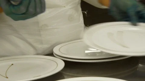Chef decorating dessert plates  Stock Footage 81458304