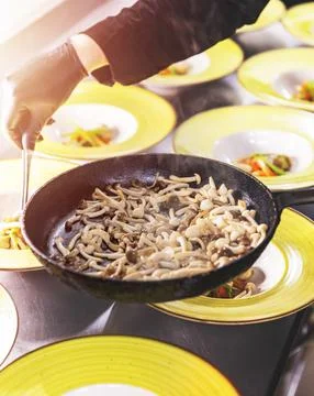 Chef decorating a dish Stock Photos