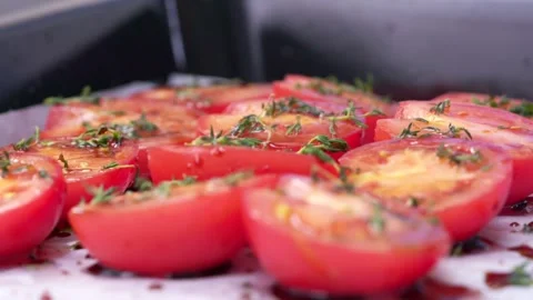 Chef decorating tomatoes with thyme. Stock Footage 136878575