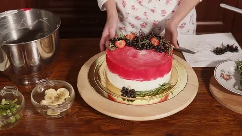 Chef demonstrates the finished cake Stock Footage 85078202