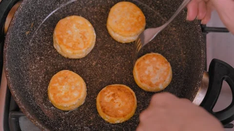 Chef demonstrates perfect timing for evenly cooked pancake disks 스톡 동영상 328494741
