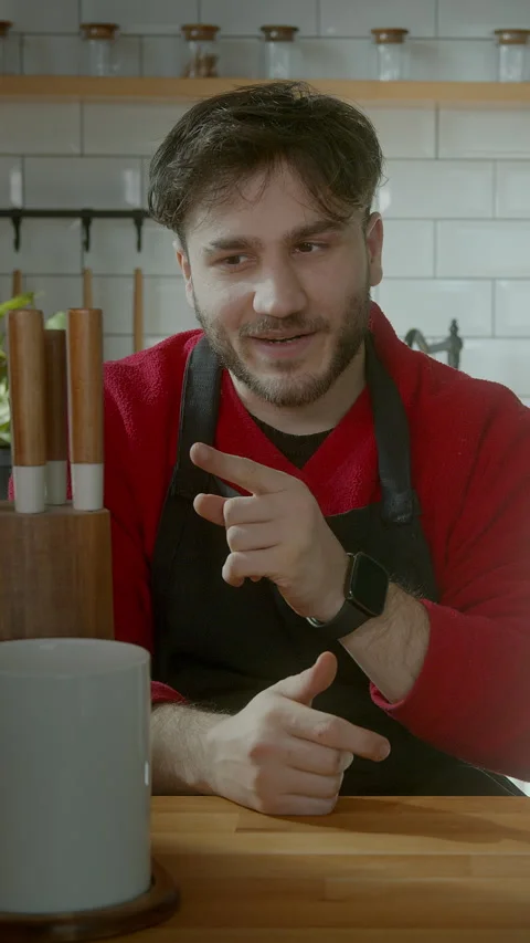 Chef demonstrating knife skills while recording a cooking tutorial, vertica.. 動画素材 303692288