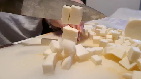 Chef dices mozzarella Stock Footage 127893891