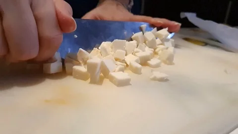 Chef dices mozzarella Stock Footage 127894143