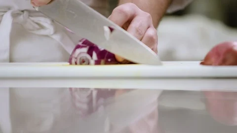 A chef dices red onion Stock Footage 91052784