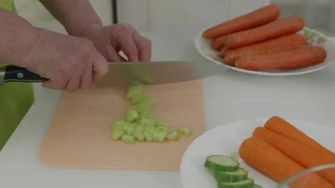Chef dicing celery on cutting board Stock Footage 321041929