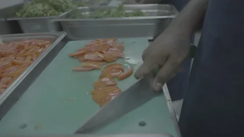 Chef dicing red bell peppers on a green cutting board Stock-Footage 327356196