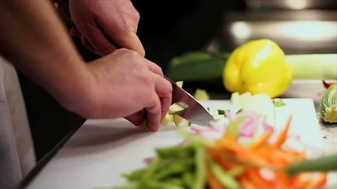 Chef Dicing Vegetables on Chopping Board Stock Footage 72922407
