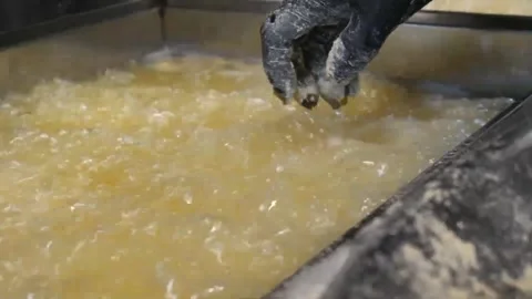 Chef dipping raw breaded chicken into batter for Korean fried chicken Stock-Footage 343028765