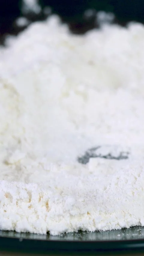 Chef dips slices of hake or pollock fish into flour in plate for preparation. Stock Footage 160289819