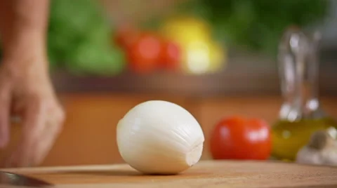 Chef divide a onion in slow motion Stock Footage 52914480