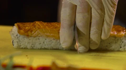 Chef divides Salmon Sushi Roll Stock Footage 66463807