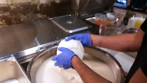 The chef is dividing mozzarella cheese to make pizza Stock Footage 171736751