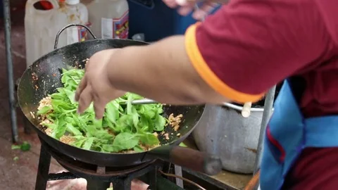 Chef doing pork fried with basil and seasoned. Stock Footage 81675221