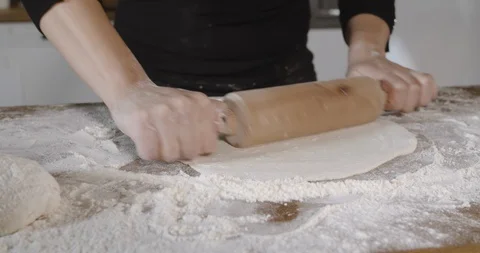 Chef dough rolled with a rolling pin slow motion. Stock Footage 124877144