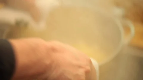 Chef draining steaming pasta Stock Footage 117541302