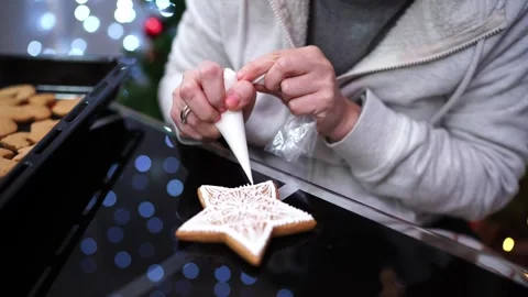 Chef draws patterns on cookies with a pastry bag Stock Footage 255002173
