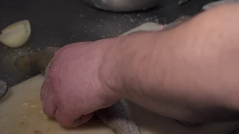 Chef dredging the fish before frying Stock Footage 74082516