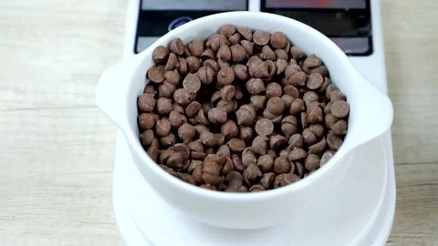 The chef drops the chocolate chips Stock Footage 232968324