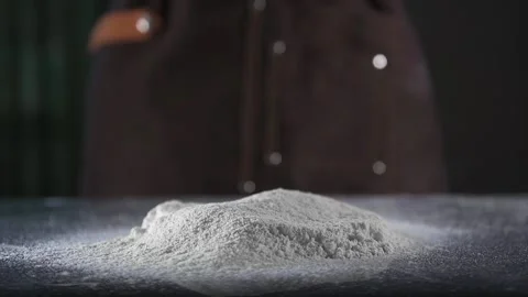 Chef drops dough on flour Stock Footage 134954862