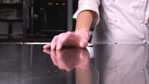The chef is drumming his fingers on the table, close up Stock Footage 124166101