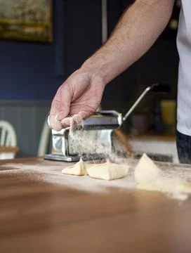 A chef dusting with flour as he prepares fresh italian homemade pasta Stock Photos