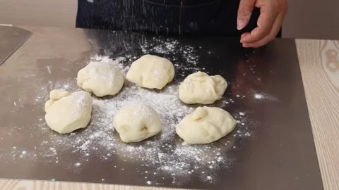 Chef Dusting Flour Over Fresh Dough Portions Stock Footage 342120019