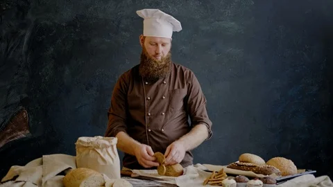 Chef eats a slice of freshly prepared bread to check the quality 스톡 동영상 103350968